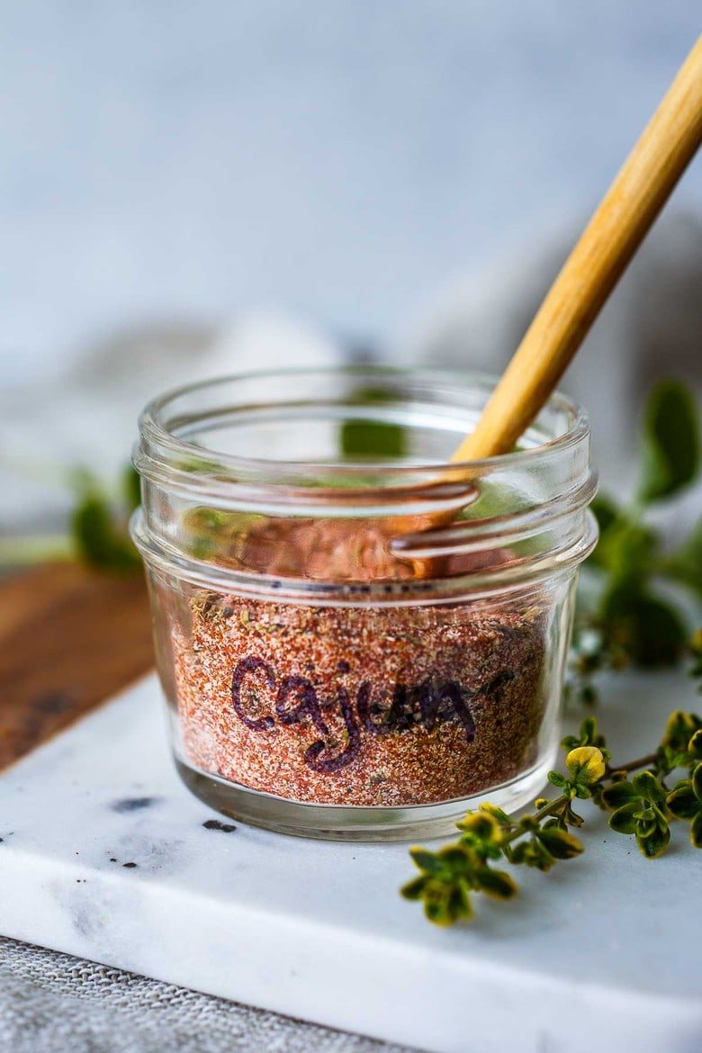This simple Cajun Seasoning Recipe is made from basic pantry spices- easy to make in about 5 minutes!  Customize your own savory zesty spice blend that is more flavorful than store-bought!