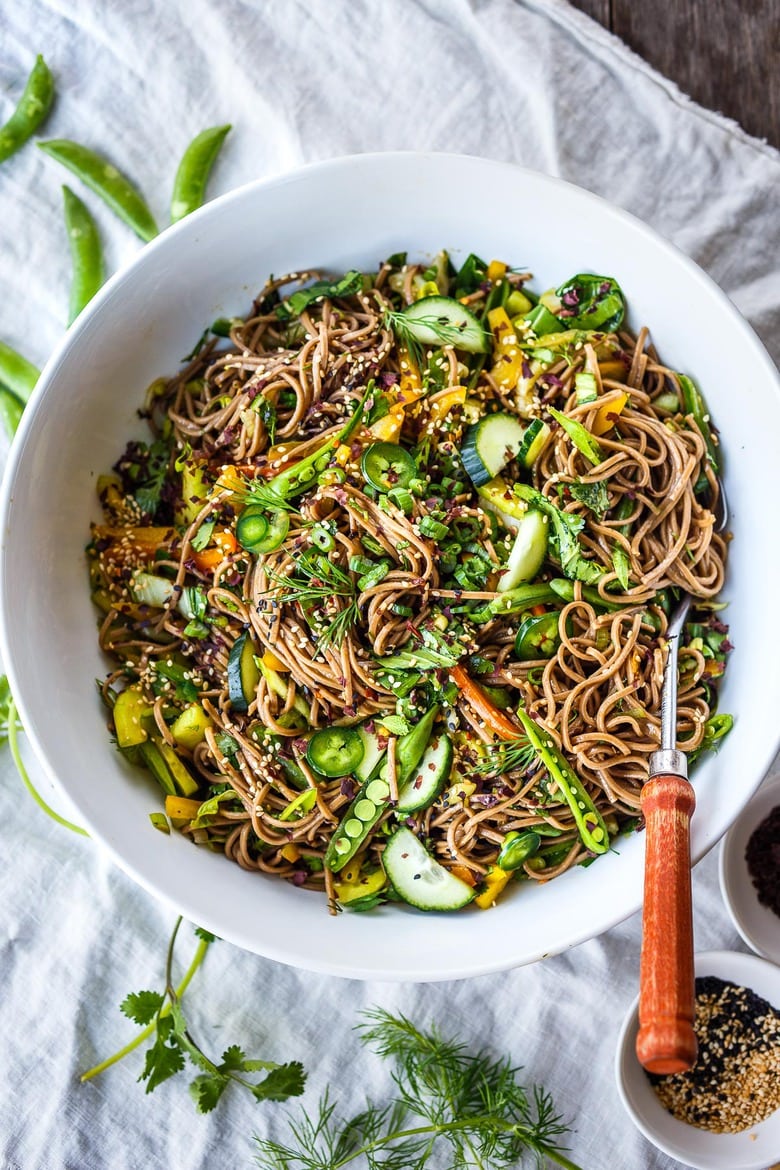 Here is a simple recipe for Soba Noodle Salad, loaded with veggies, that is adaptable and vegan!  For a protein boost, top with savory baked tofu, smoked salmon, grilled chicken.  Quick, easy and full of earthy crunchy goodness.