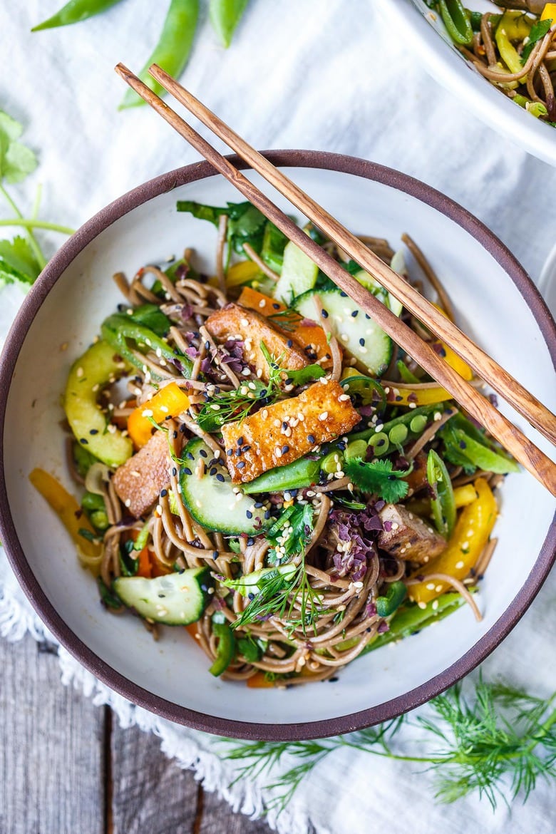 Here is a simple recipe for Soba Noodle Salad, loaded with veggies, that is adaptable and vegan!  For a protein boost, top with savory baked tofu, smoked salmon, grilled chicken.  Quick, easy and full of earthy crunchy goodness.