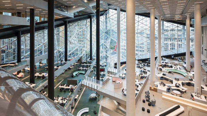 The vast newsroom atrium, with multiple levels, regions and open plan zones, connected by an intricate lattice of walkways and bridges. Image Credit: LAURIAN GHINITOIU