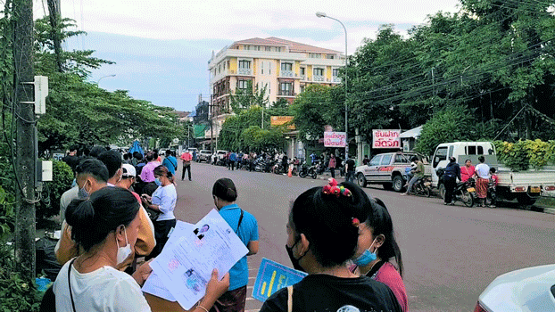 laos-passport-applications-vientiane-jun10-2022.jpg Laotians check their passport applications as they wait to submit them to the Consular Department at the Ministry of Foreign Affairs in Vientiane, Laos, June 10, 2022. Credit: RFA