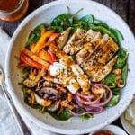 This spinach salad is a twist on the classic with deeply flavored with grilled mushrooms, red onions, sweet peppers and herby grilled chicken.  Topped with our flavorful take on a healthy French style dressing.  A perfect complete dinner for warm days.