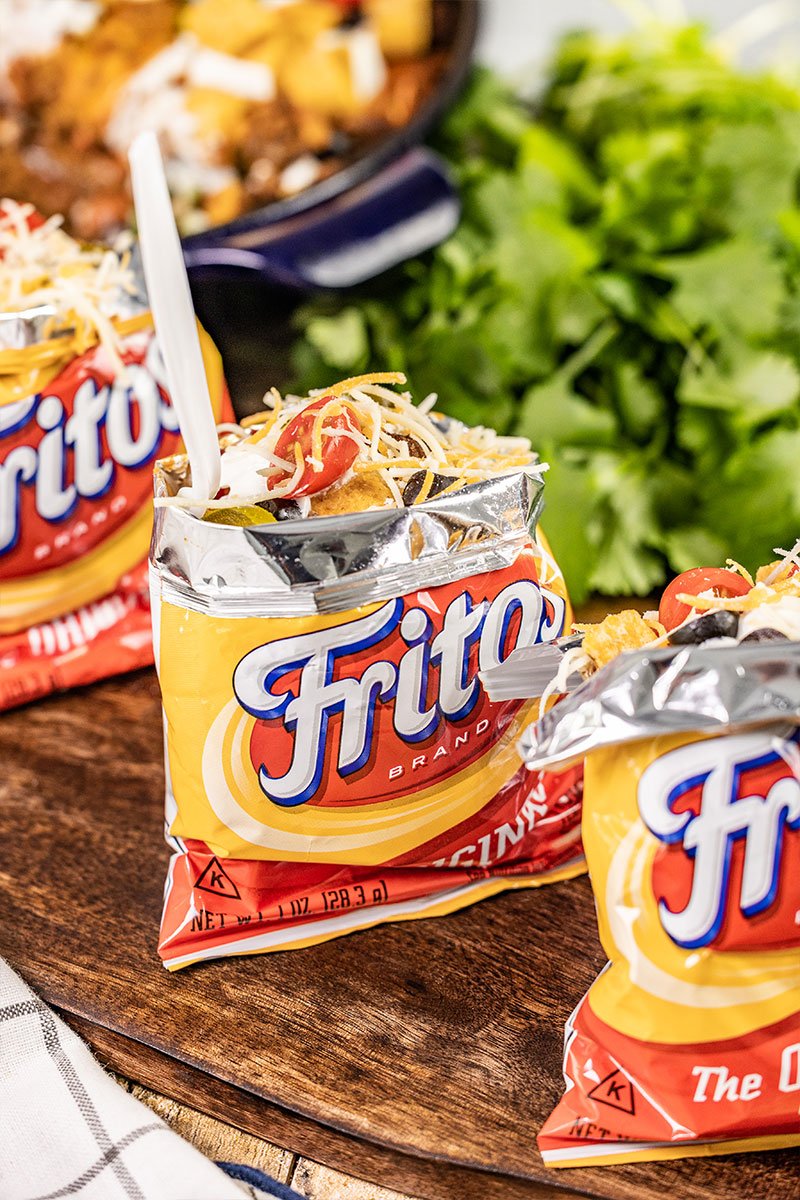 Savory crispy frito pie in a frito bag.